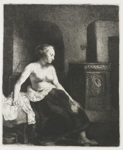 Woman Sitting Half Dressed Beside a Stove