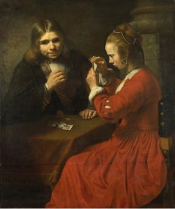 A Young Man and a Girl playing Cards